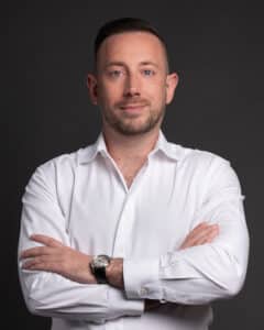 Headshot of Jordan Barber in a white shirt