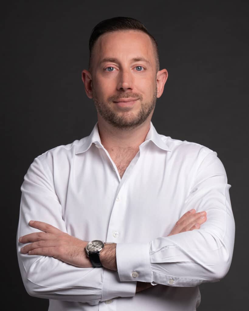 Headshot of Jordan Barber in a white shirt